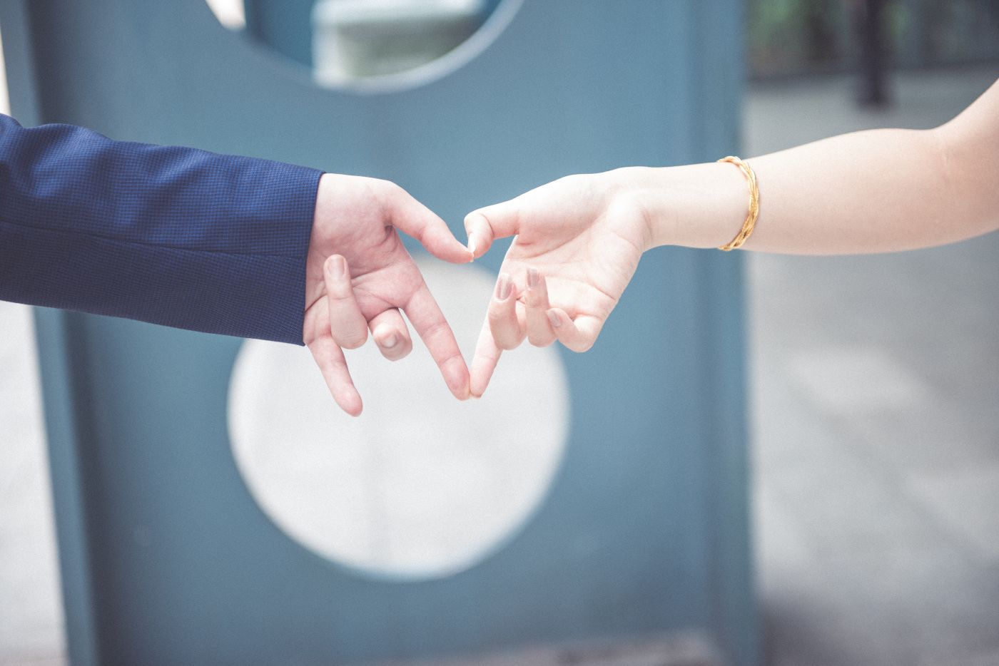 Couple making a heart with their hands