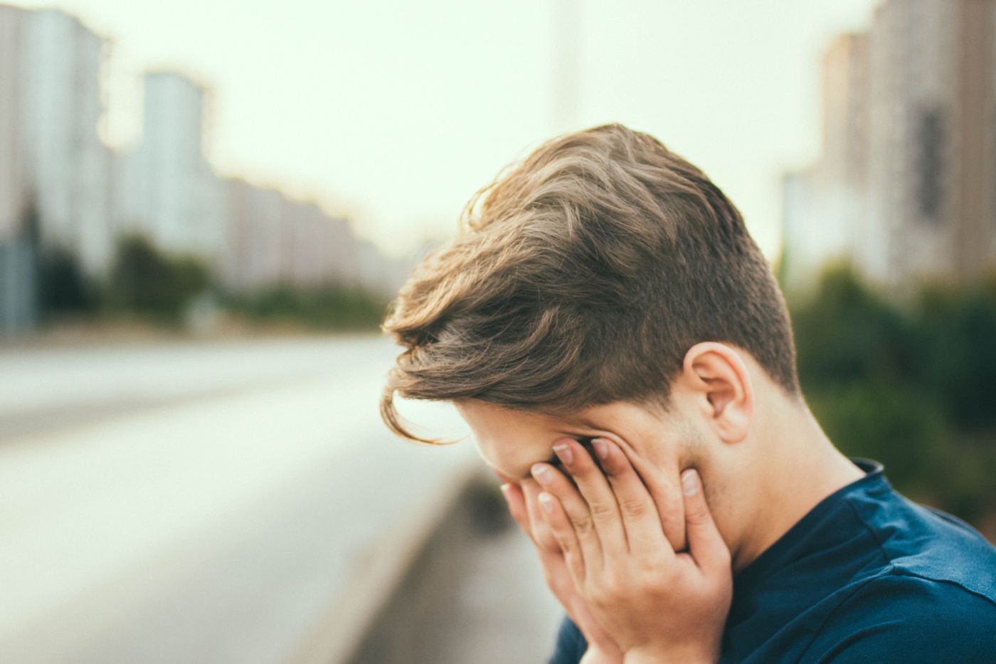 boy with face in his palms