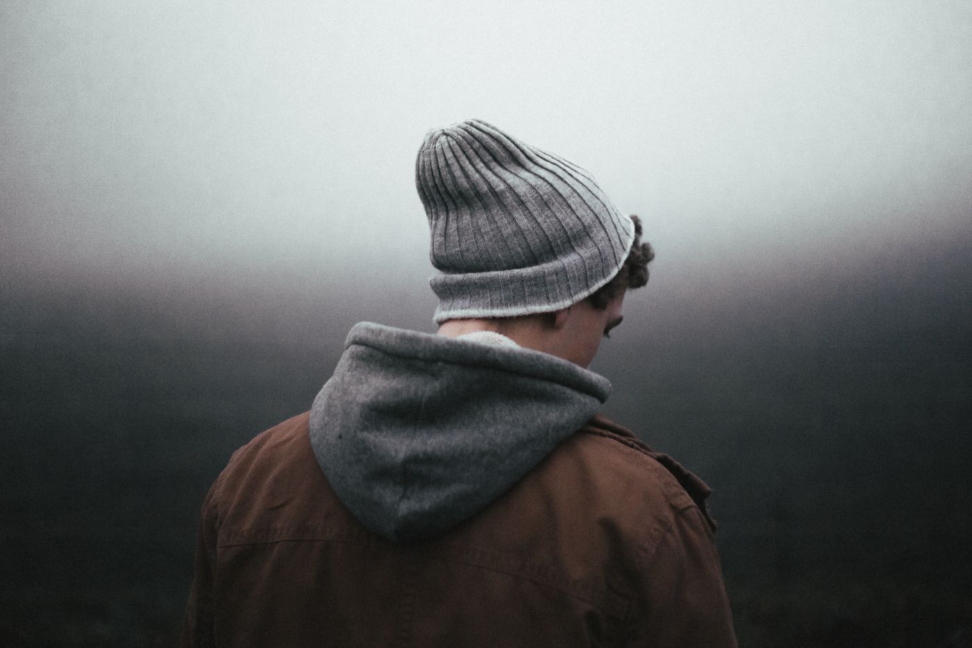 person in stocking cap and hoodie